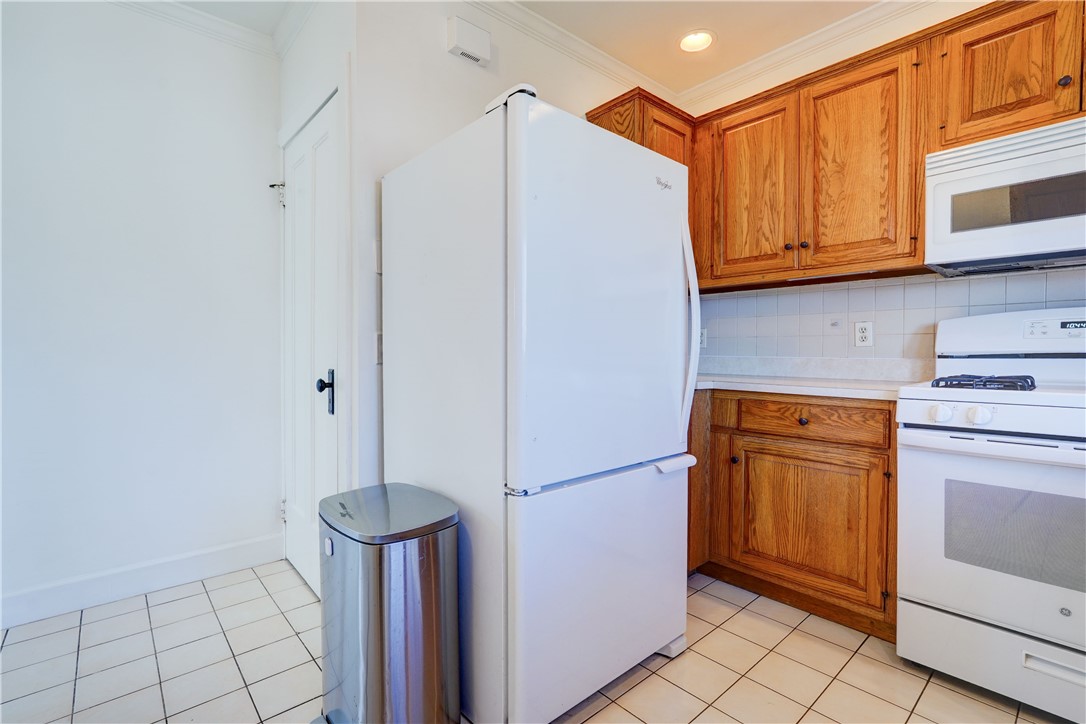 134 Wyndham Road Rochester, NY 14612 - Photo 13 of 31 Kitchen with side entry and stairs to basement.