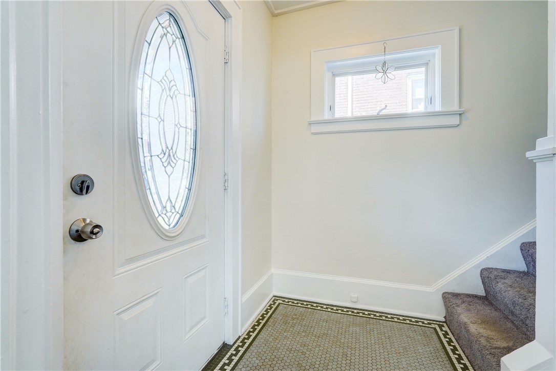 134 Wyndham Road Rochester, NY 14612 - Photo 4 of 31 Entry with original tile and stairs to bedrooms.