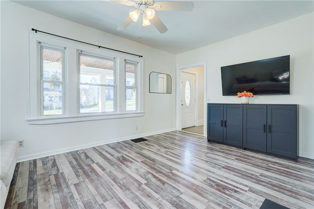 134 Wyndham Road Rochester, NY 14612 - Photo 6 of 31 Living room with view back toward the front entry.