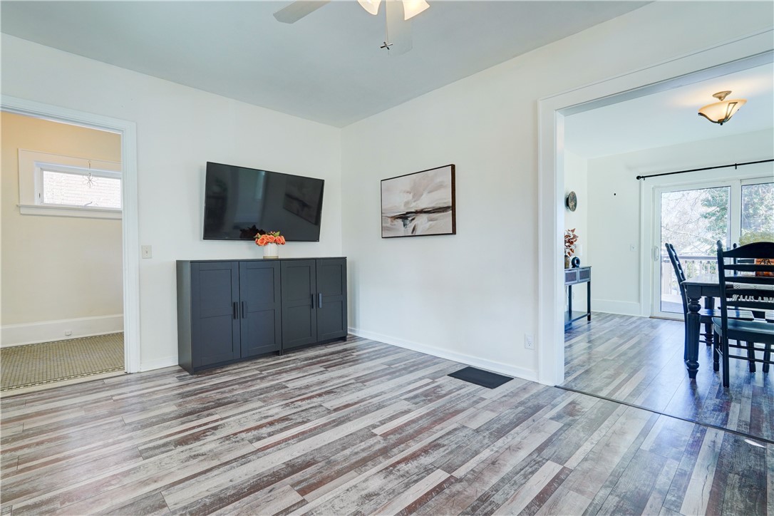 134 Wyndham Road Rochester, NY 14612 - Photo 7 of 31 Living room opens into the dining room.