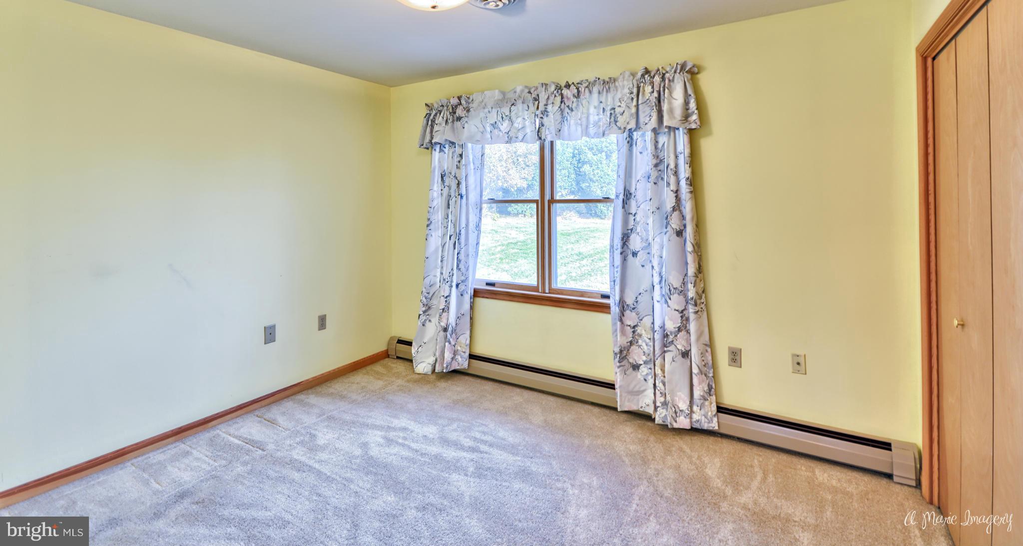 8021 Rocky Springs Road Frederick, MD 21702 - Photo 11 of 30 a view of an empty room with a window