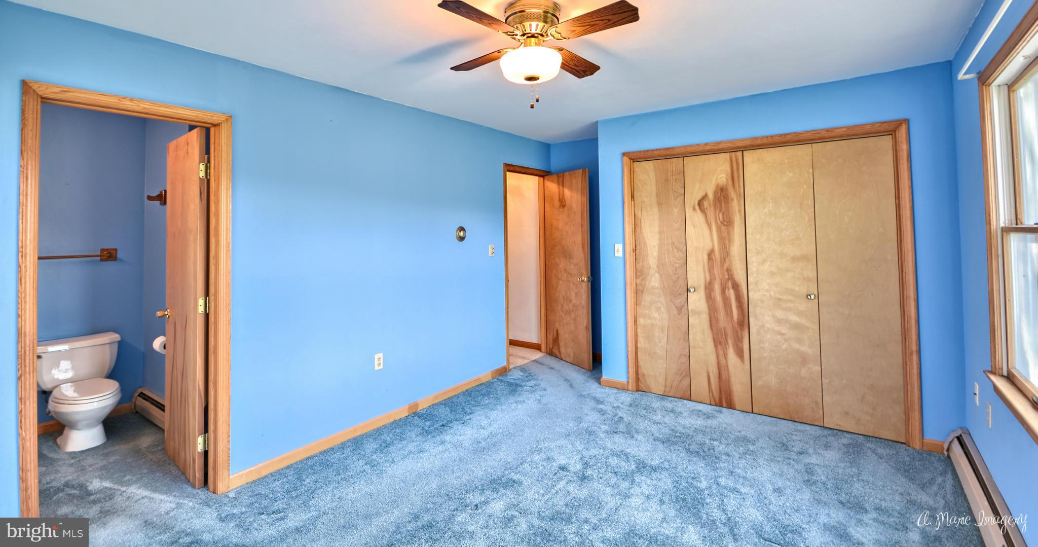 8021 Rocky Springs Road Frederick, MD 21702 - Photo 15 of 30 a view of an empty room with a window and bathroom