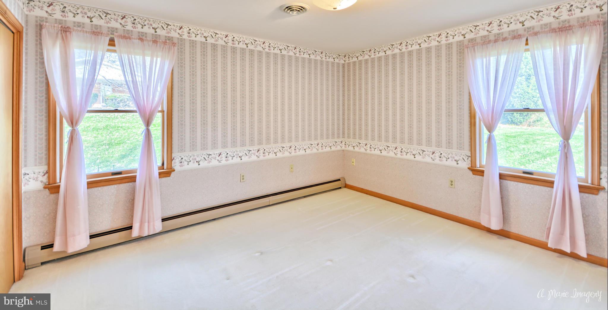 8021 Rocky Springs Road Frederick, MD 21702 - Photo 17 of 30 a view of an empty room and window