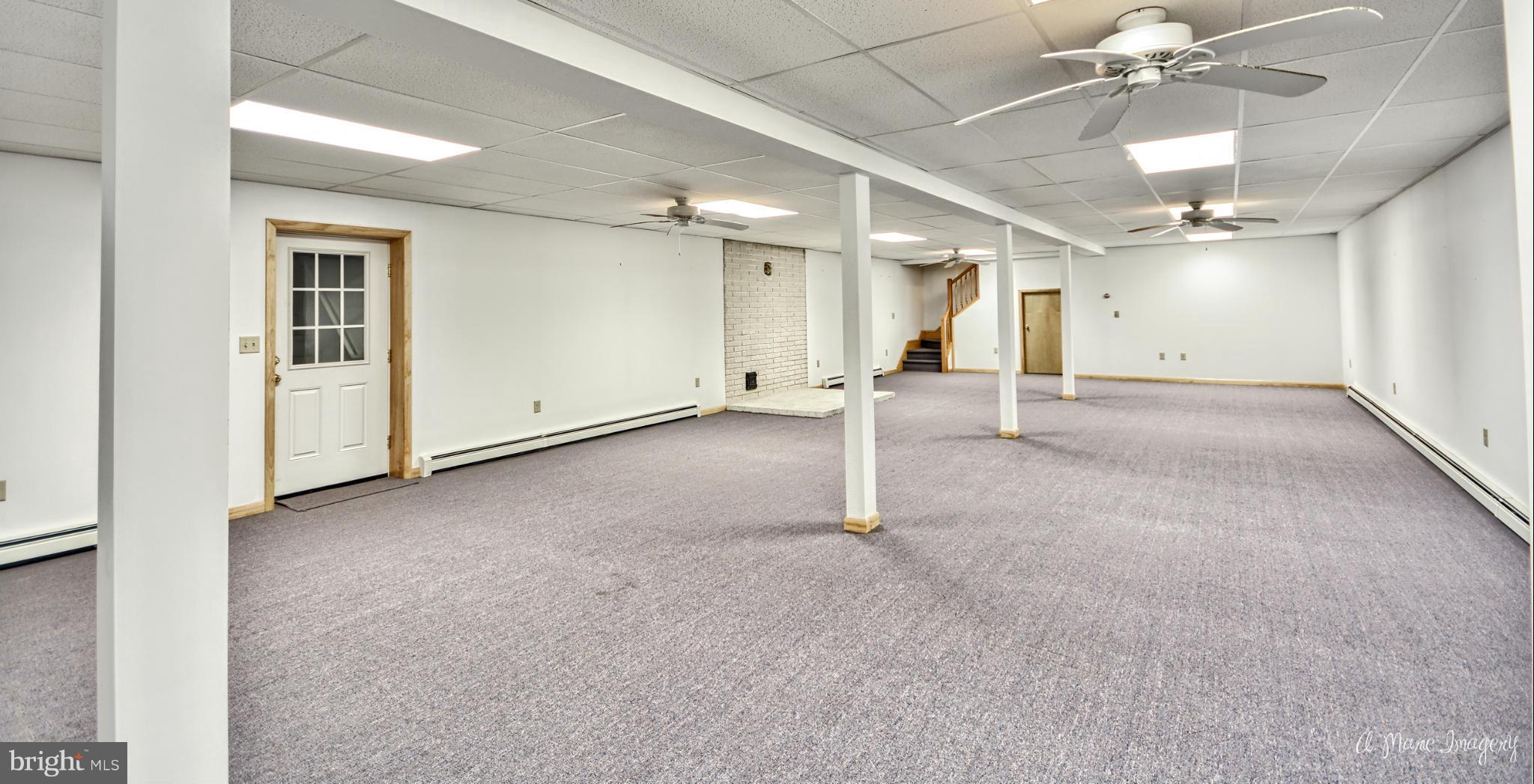 8021 Rocky Springs Road Frederick, MD 21702 - Photo 20 of 30 an empty room with a ceiling fan and entryway