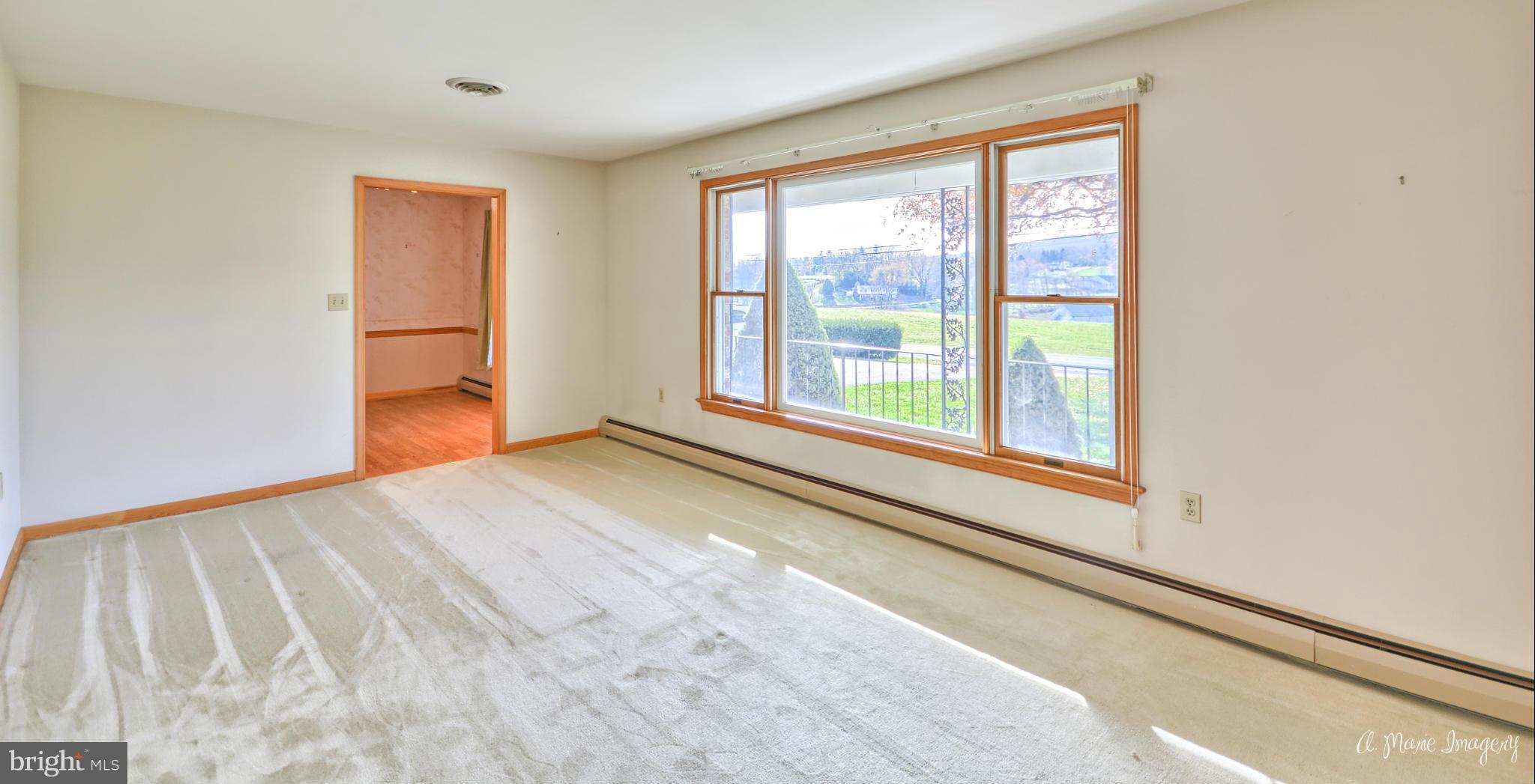 8021 Rocky Springs Road Frederick, MD 21702 - Photo 3 of 30 a view of an empty room with a window