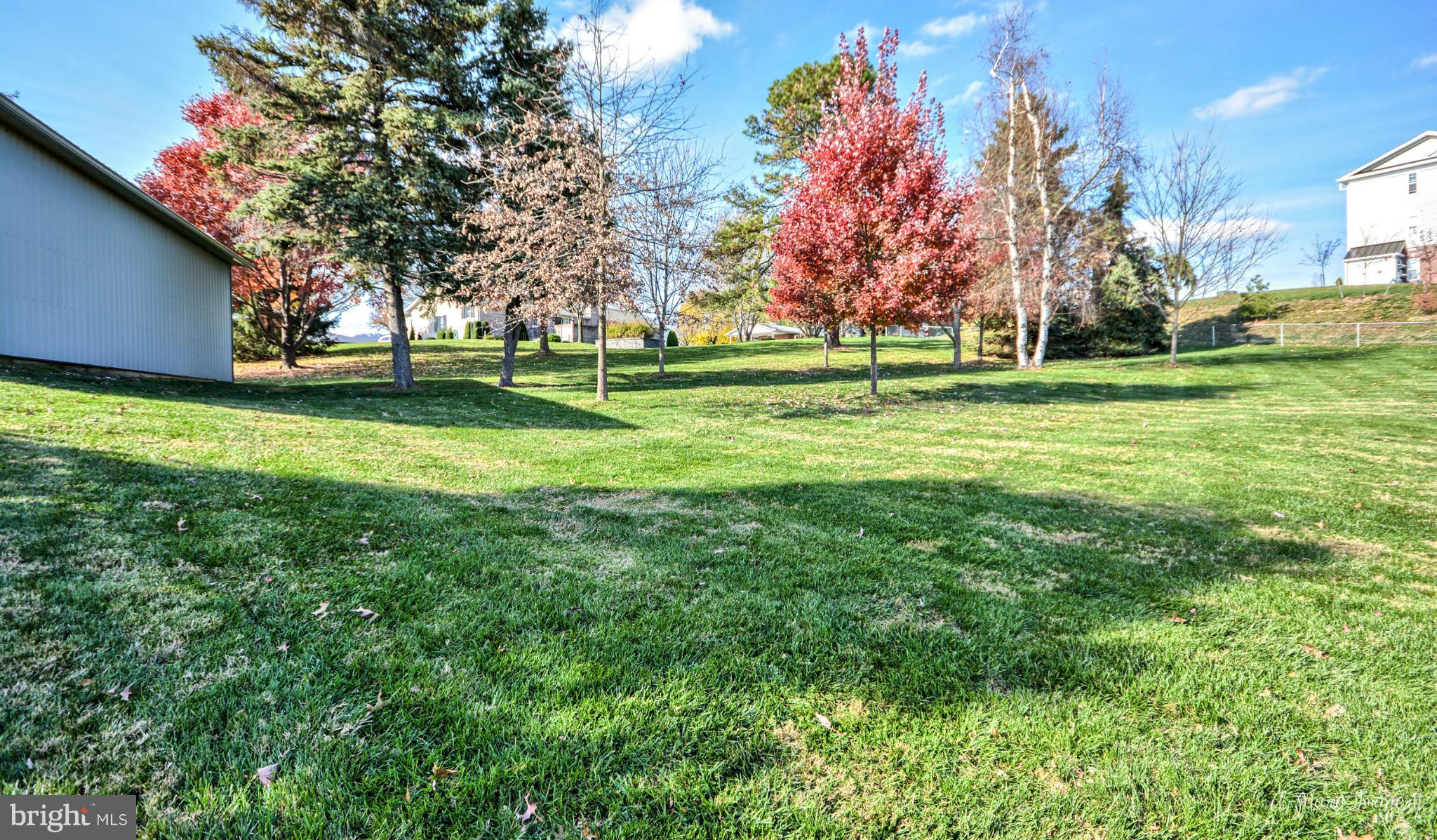 8021 Rocky Springs Road Frederick, MD 21702 - Photo 23 of 30 a backyard of apartments with large trees