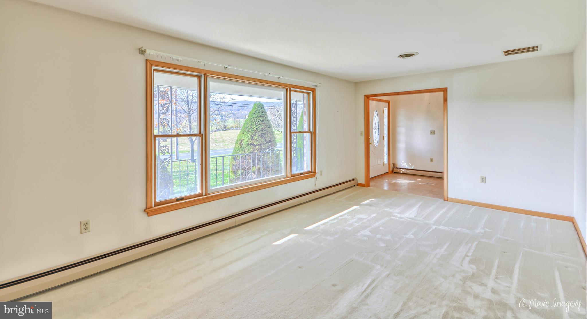 8021 Rocky Springs Road Frederick, MD 21702 - Photo 4 of 30 a view of an empty room with a window