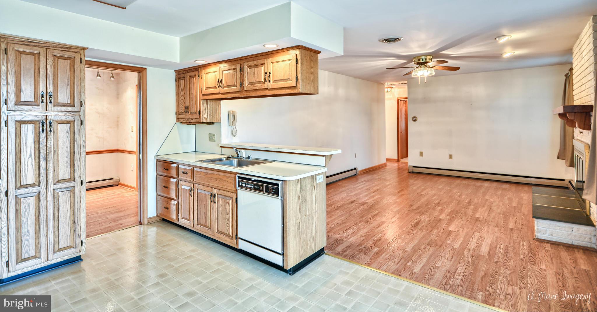 8021 Rocky Springs Road Frederick, MD 21702 - Photo 7 of 30 a kitchen with stainless steel appliances a stove top oven and a refrigerator