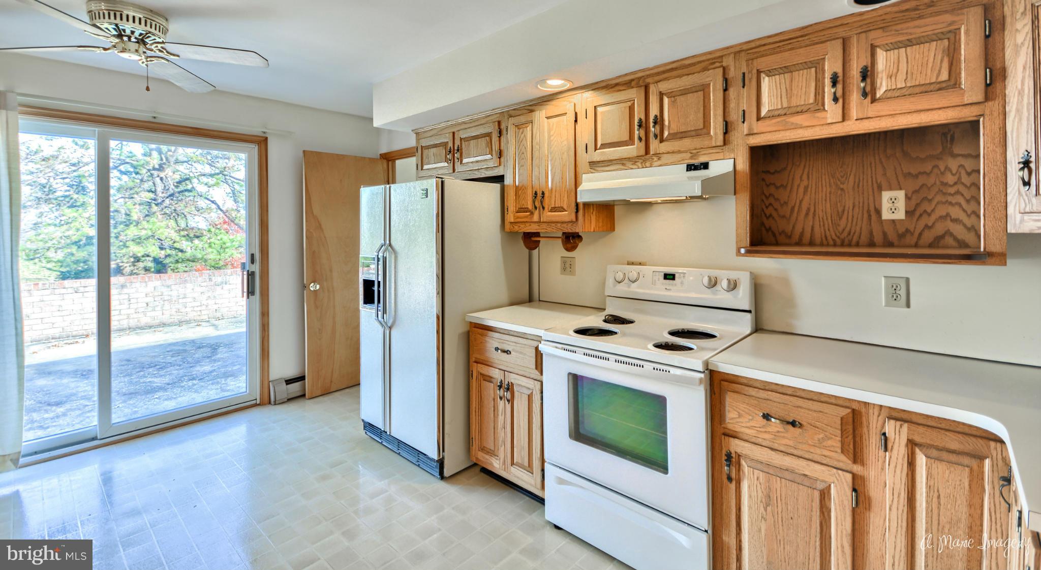 8021 Rocky Springs Road Frederick, MD 21702 - Photo 8 of 30 a kitchen with a stove oven and a refrigerator