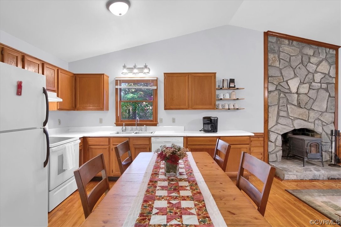 3350 Forest Grove Road Sandy Hook, VA 23153 - Photo 12 of 42 a large kitchen with kitchen island a stove a sink dishwasher and a microwave oven with wooden floor