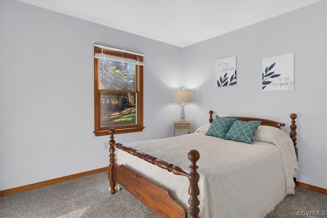 3350 Forest Grove Road Sandy Hook, VA 23153 - Photo 23 of 42 a bed room with a bed and a window