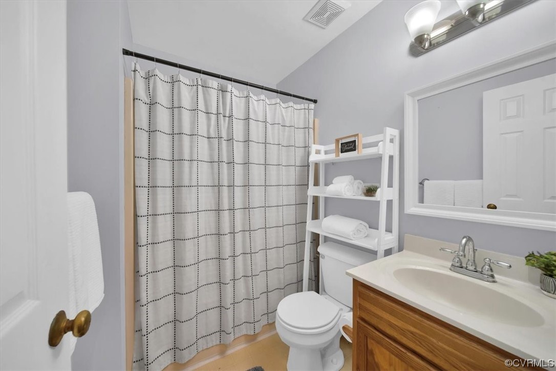3350 Forest Grove Road Sandy Hook, VA 23153 - Photo 25 of 42 a bathroom with a sink toilet and shower