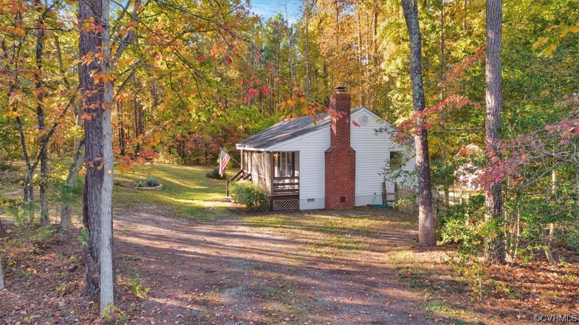 3350 Forest Grove Road Sandy Hook, VA 23153 - Photo 35 of 42 a view of a house with backyard and a tree