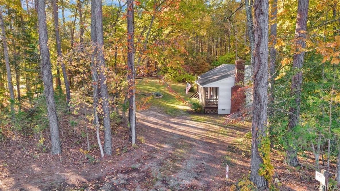 3350 Forest Grove Road Sandy Hook, VA 23153 - Photo 38 of 42 a view of a house with a tree next to a yard