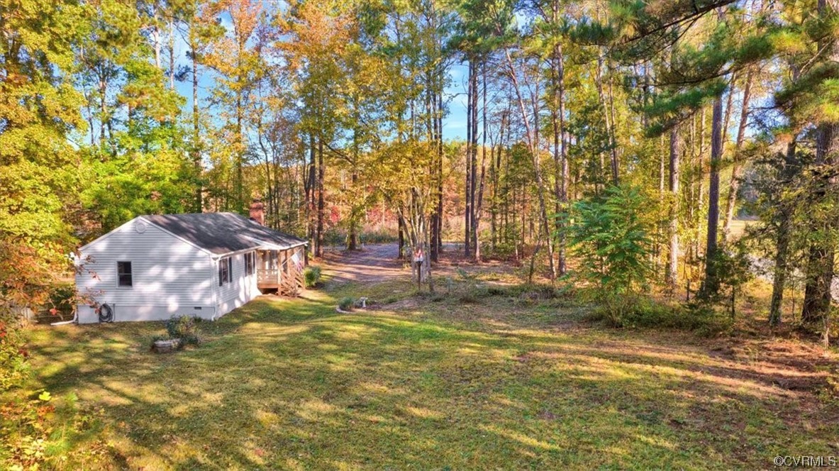 3350 Forest Grove Road Sandy Hook, VA 23153 - Photo 6 of 42 a view of a yard with large trees