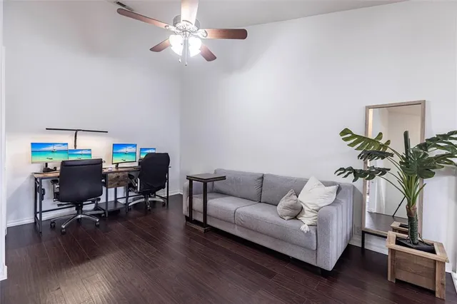 a living room with furniture and a potted plant