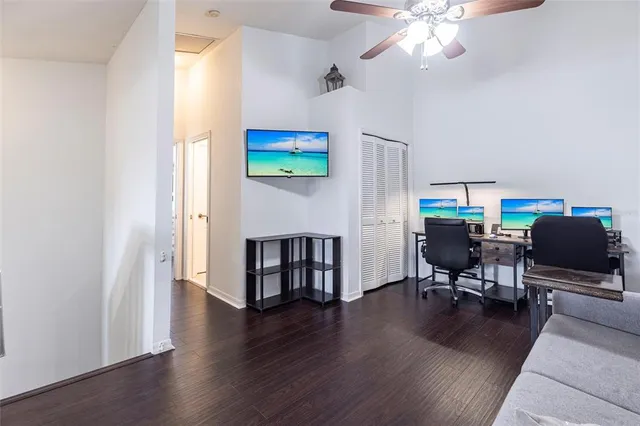 a view of a livingroom with furniture and a flat screen tv