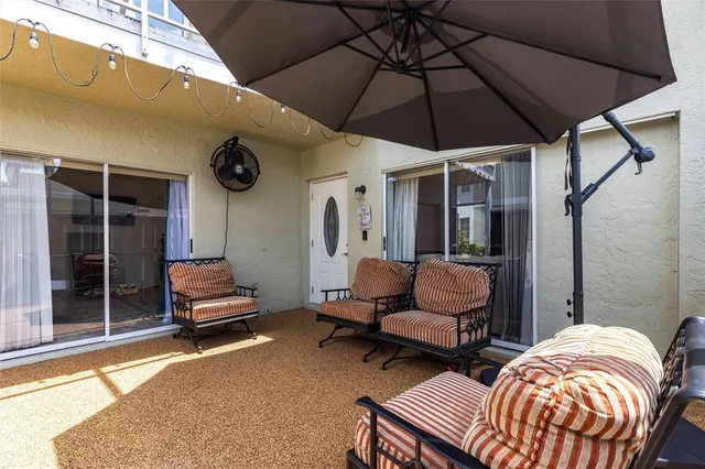 a outdoor space with patio couch and a table