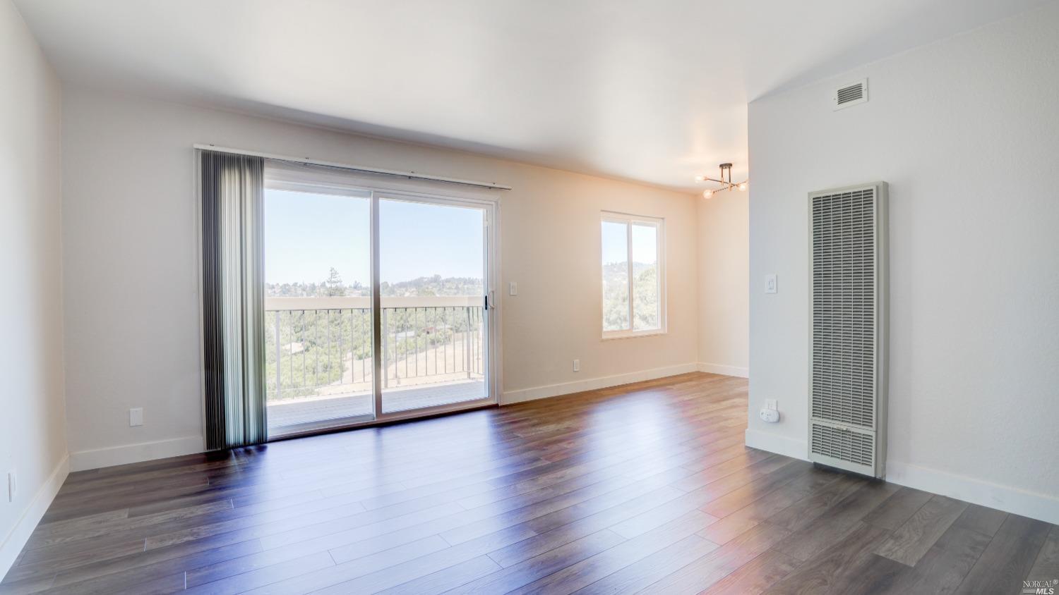 5314 Ridgeview Circle, Unit 4 El Sobrante, CA 94803 - Photo 1 of 1 Living Room with Dining Area to the right.
