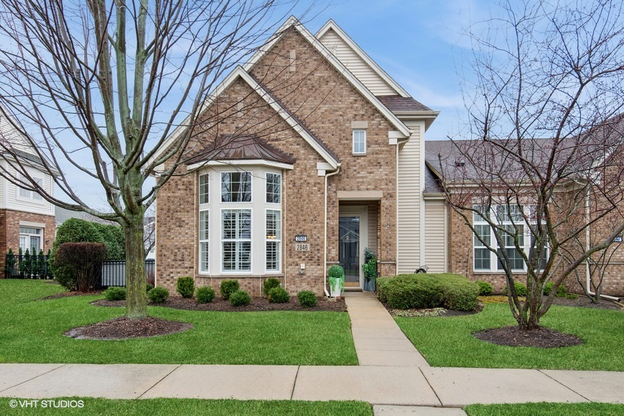 front view of a house with a yard