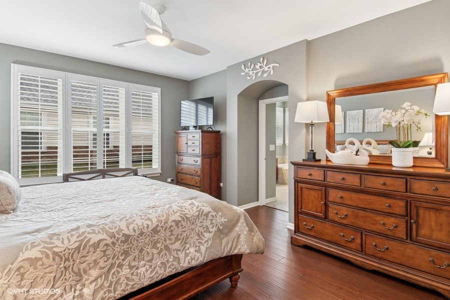 2846 Normandy Circle Naperville, IL 60564 - Photo 11 of 44 a bedroom with a large bed and a large window