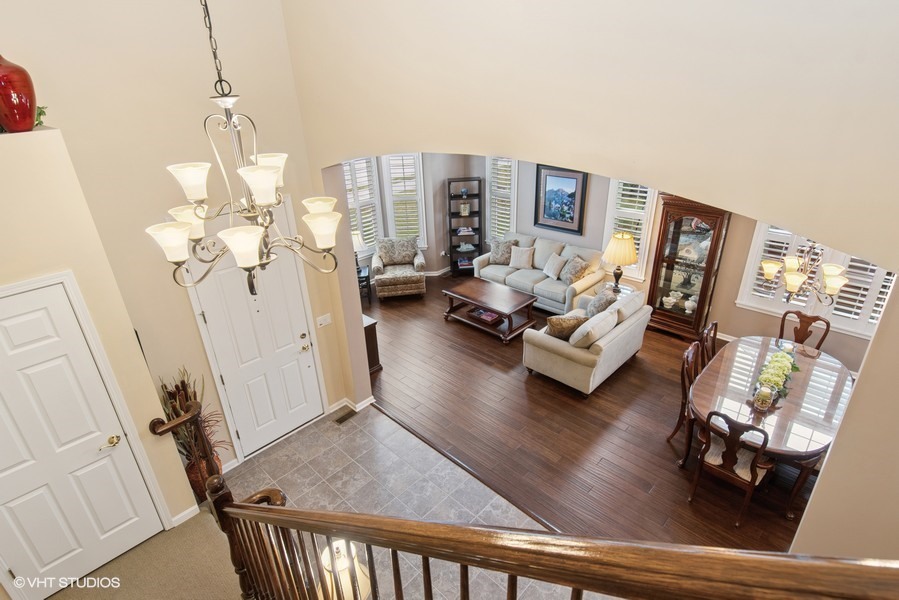 2846 Normandy Circle Naperville, IL 60564 - Photo 14 of 44 a living room with furniture and a wooden floor