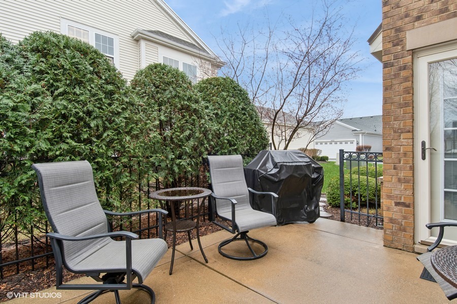 2846 Normandy Circle Naperville, IL 60564 - Photo 21 of 44 a view of a chairs and table in backyard of the house
