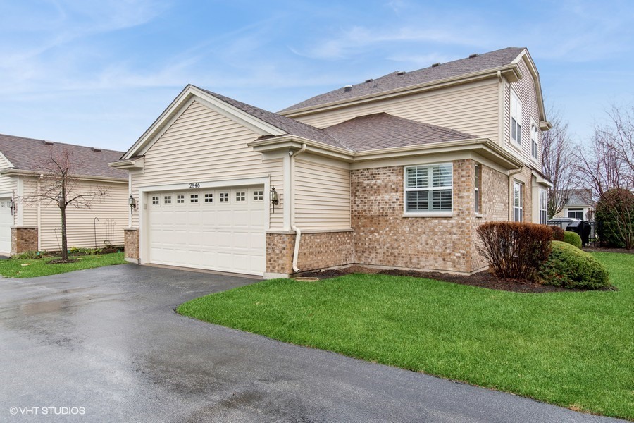 2846 Normandy Circle Naperville, IL 60564 - Photo 23 of 44 a front view of a house with a yard and garage