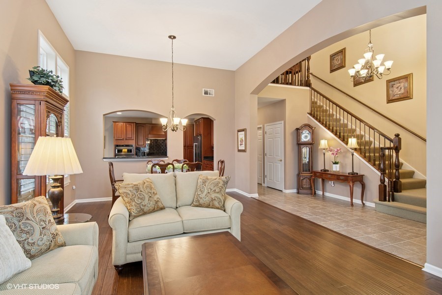 2846 Normandy Circle Naperville, IL 60564 - Photo 4 of 44 a living room with furniture and a chandelier