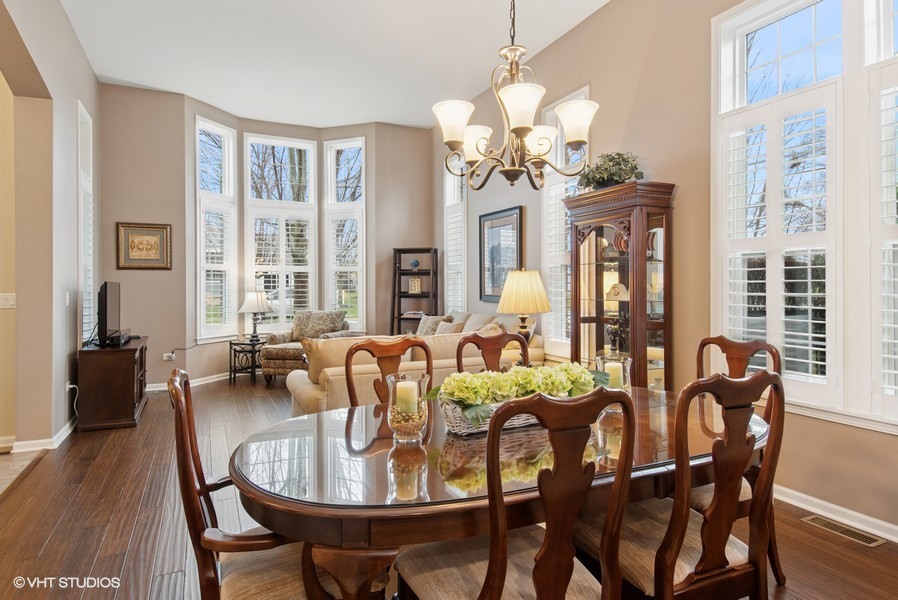 2846 Normandy Circle Naperville, IL 60564 - Photo 5 of 44 a view of a dining room with furniture window and wooden floor