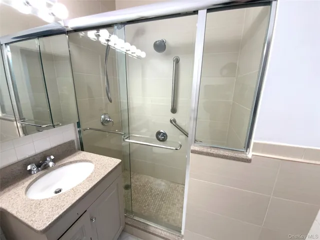 a bathroom with a sink double vanity and a mirror