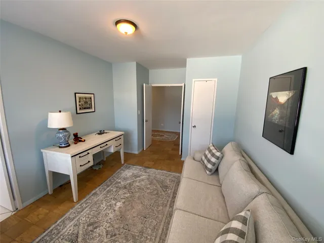 a bedroom with a bed and a lamp on table