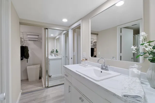 a bathroom with a sink toilet and shower