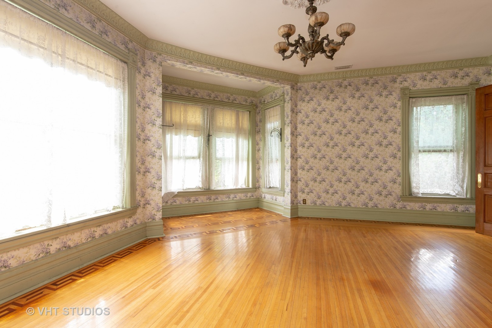 307 North Main Street Sycamore, IL 60178 - Photo 22 of 32 a view of an empty room with a window and wooden floor