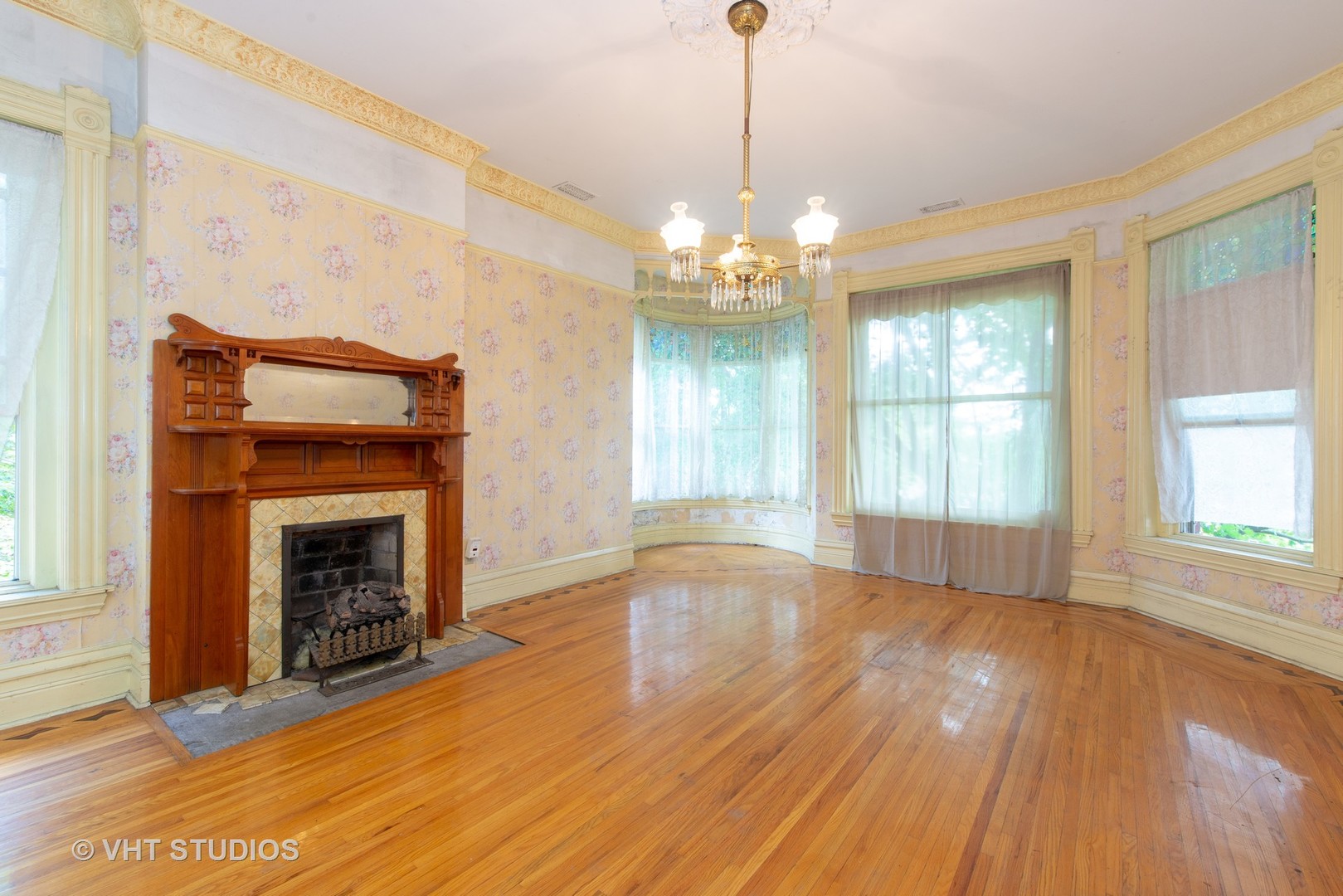 307 North Main Street Sycamore, IL 60178 - Photo 26 of 32 a view of an empty room with wooden floor fireplace and a window
