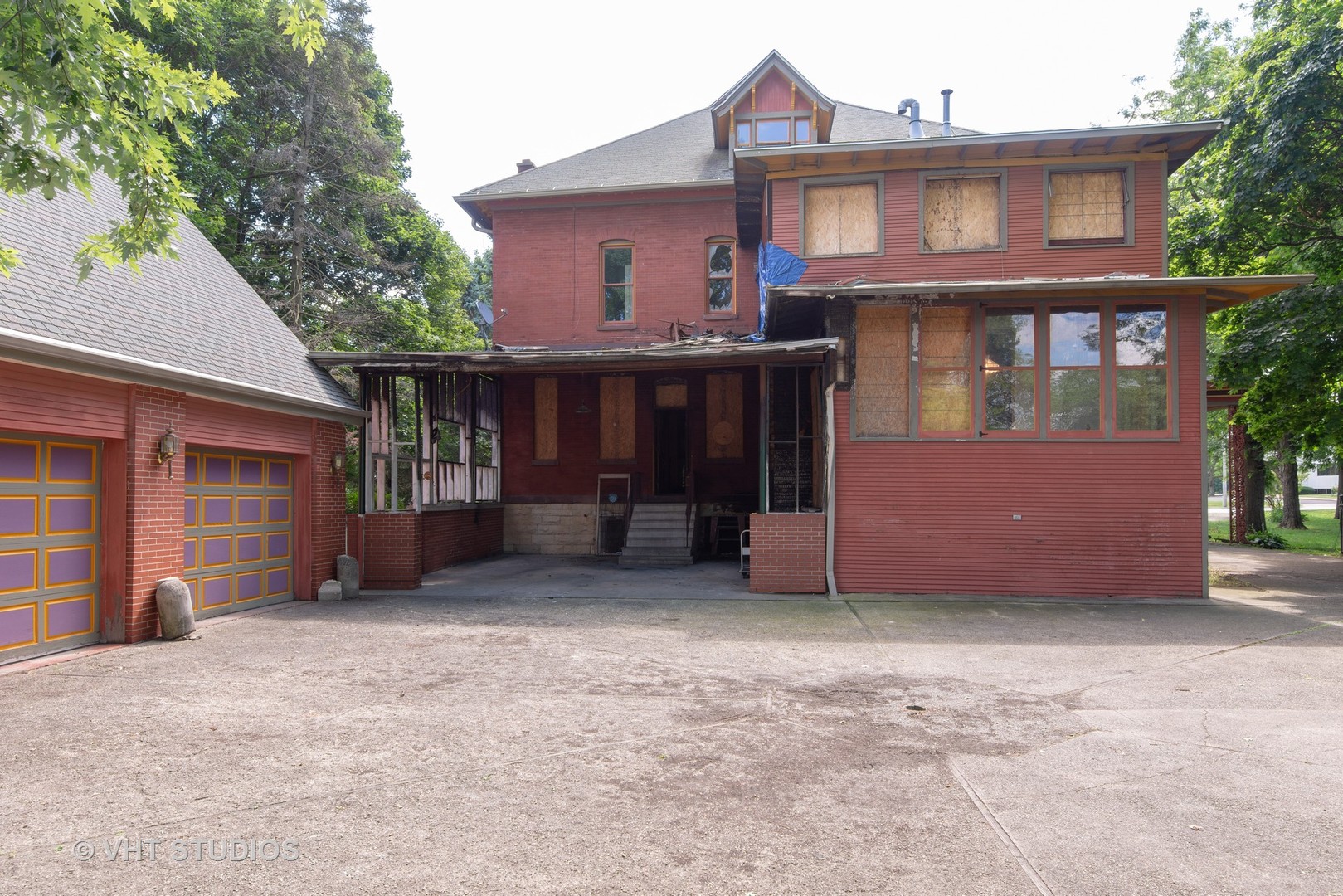 307 North Main Street Sycamore, IL 60178 - Photo 30 of 32 a front view of a house with a yard and garage