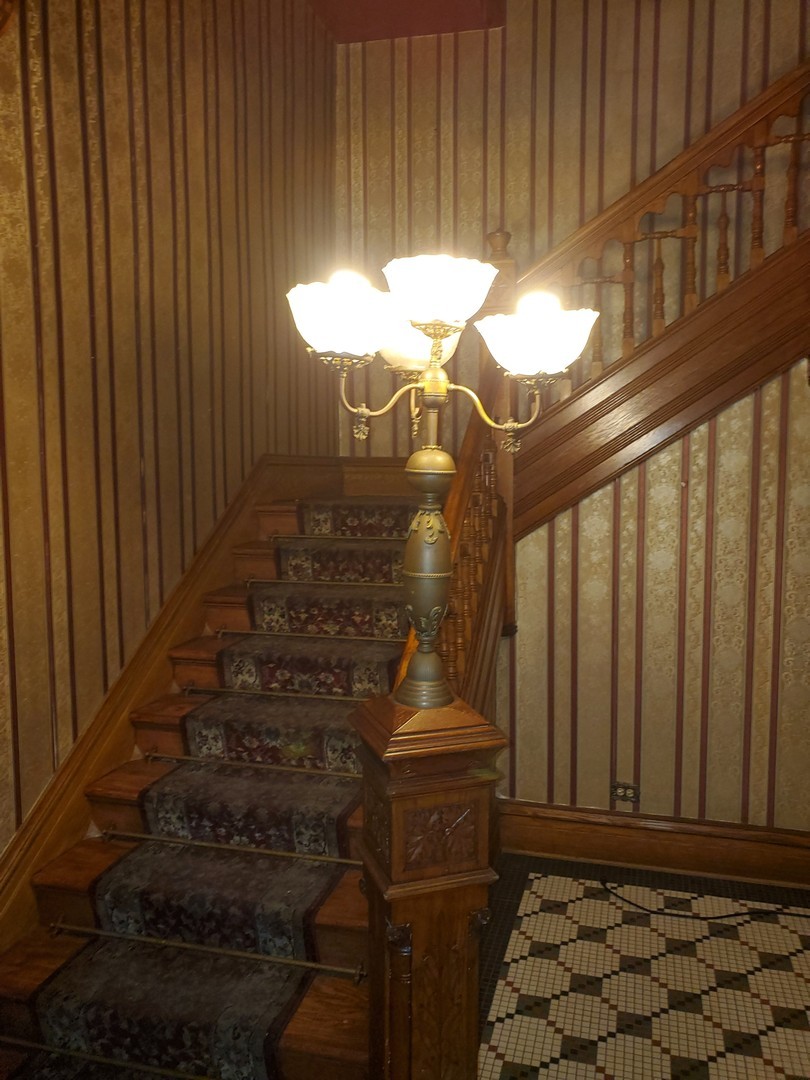 307 North Main Street Sycamore, IL 60178 - Photo 8 of 32 a bathroom with a sink and a mirror