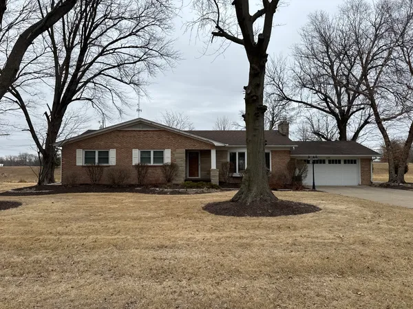 a front view of a house with yard