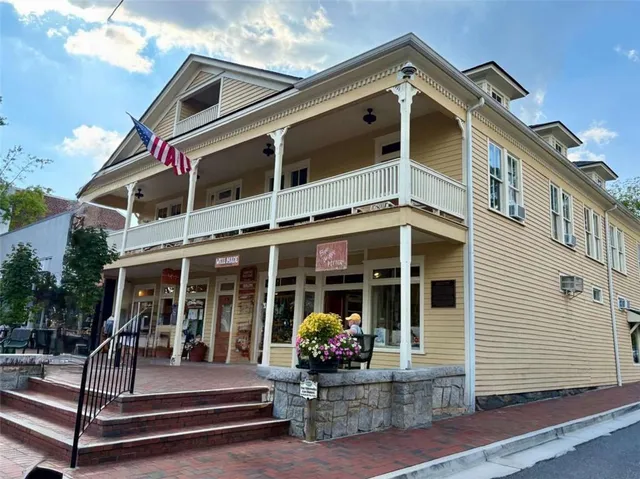 a view of a street with sitting area