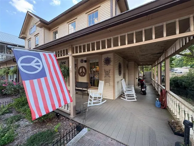 a view of a city with lush green forest