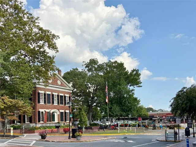 a view of a city with lush green forest