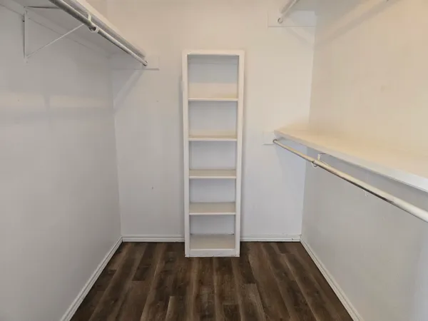 a view of an empty walk in closet