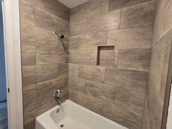 a bathroom with a sink and shower