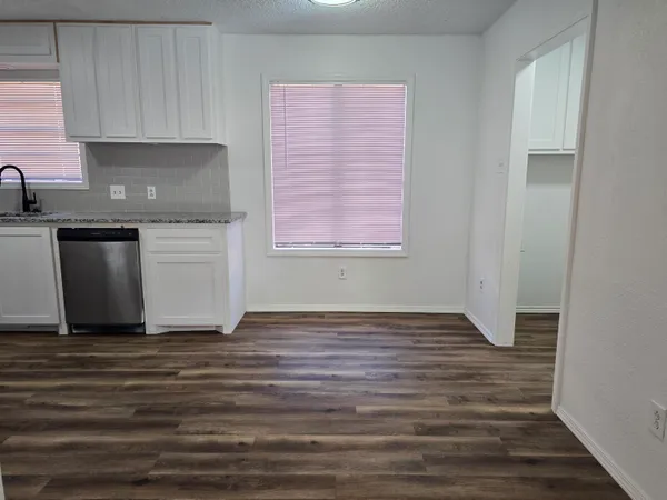 a view of a kitchen with a sink cabinets and a window