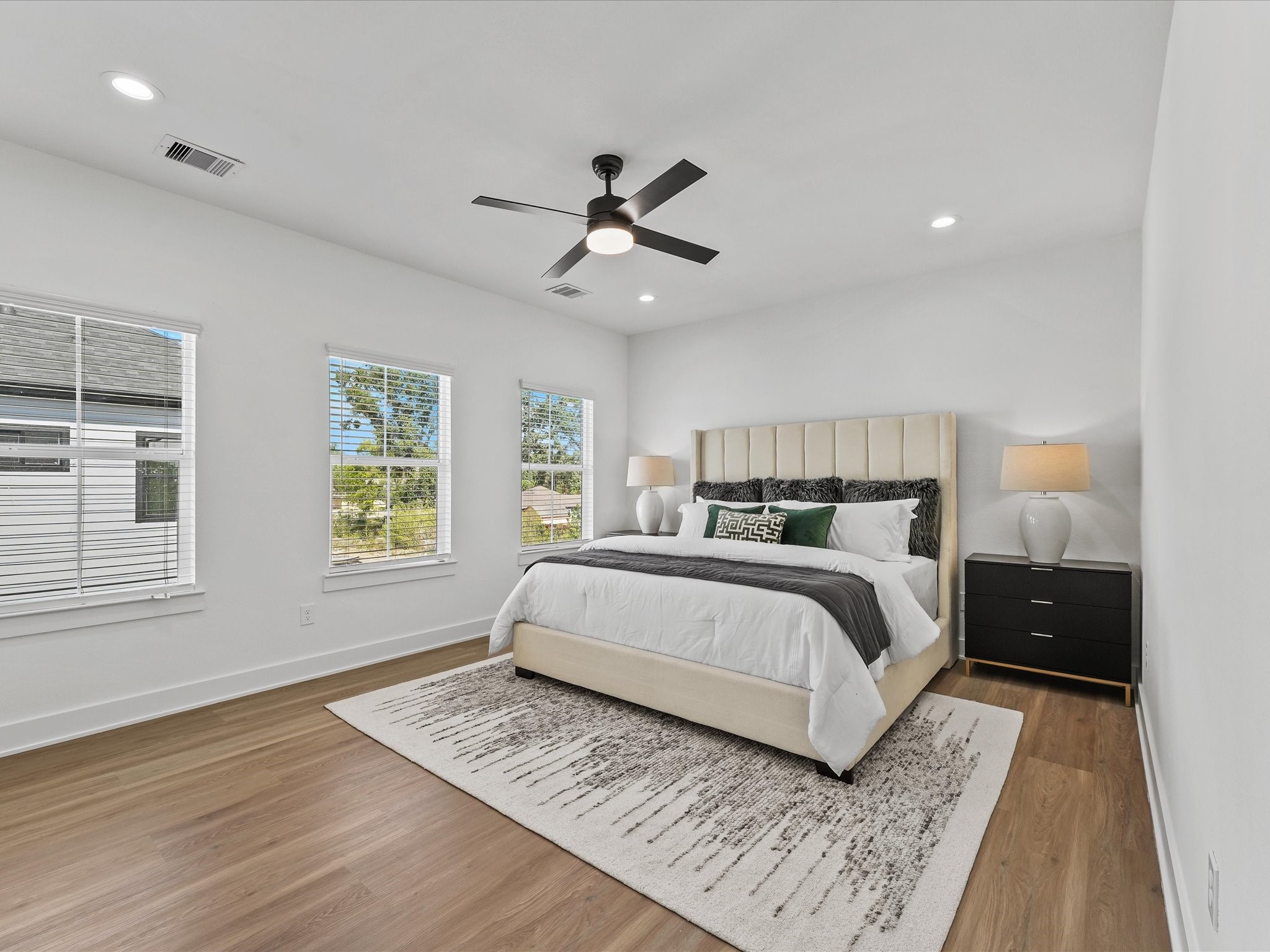 2592 West Tidwell Road Houston, TX 77091 - Photo 14 of 25 a bedroom with a large bed and a window