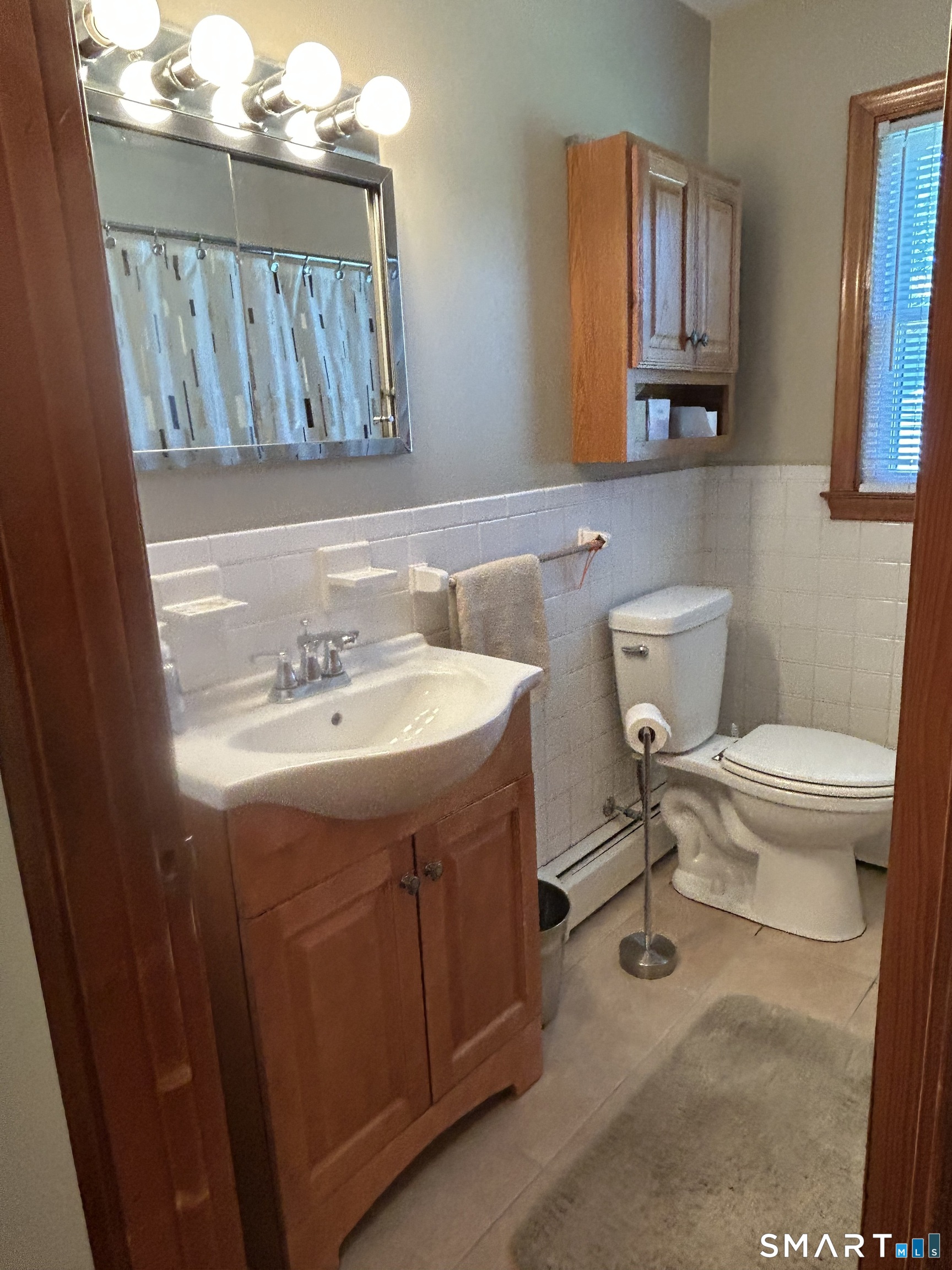13 Walnut Lane Wallingford, CT 06492 - Photo 15 of 27 a bathroom with a sink mirror and toilet