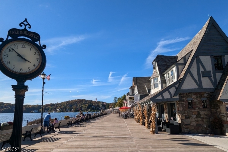 8 Triple Crown Drive Sparta, NJ 07871 - Photo 10 of 12 a front view of a house with yard and mountain view