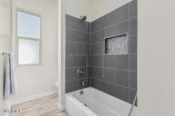 23175 West Skinner Road Wittmann, AZ 85361 - Photo 15 of 35 a bathroom with a bathtub