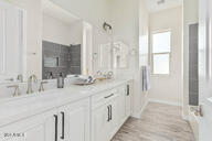 23175 West Skinner Road Wittmann, AZ 85361 - Photo 16 of 35 a bathroom with double vanity and a mirror