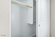 23175 West Skinner Road Wittmann, AZ 85361 - Photo 20 of 35 a bathroom with a glass shower door